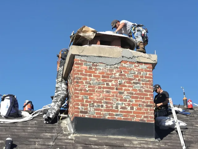 Miramar Chimney Sweep installing a custom chimney crown in Miramar, FL